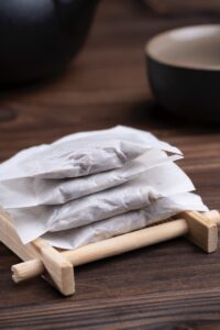 white textile on brown wooden table