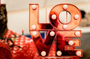 brown and white love lighted signage