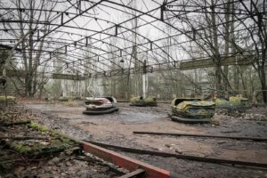 a couple of boats that are sitting in the dirt