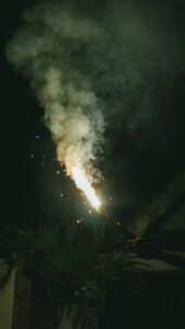 a fireworks is lit up in the night sky